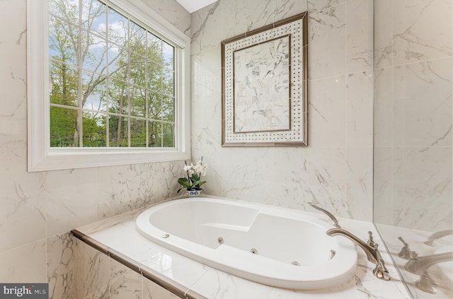 bathroom with a jetted tub