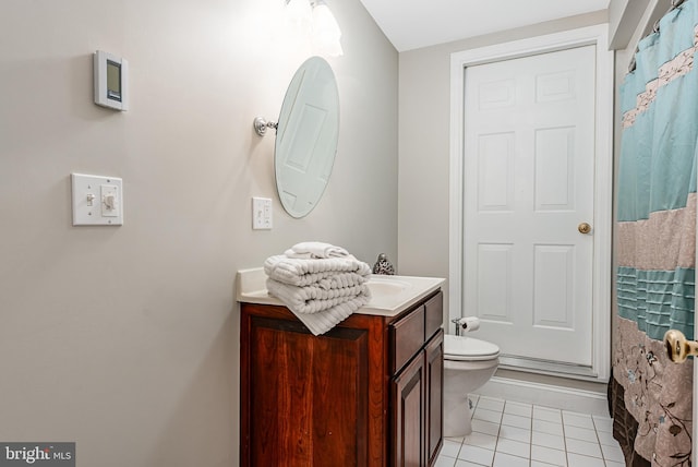 full bathroom featuring a shower with shower curtain, toilet, vanity, and tile patterned flooring