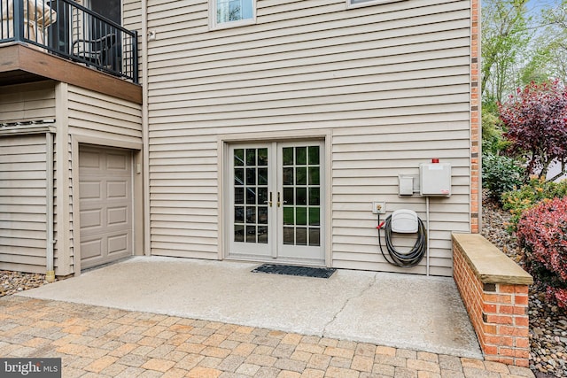 entrance to property featuring french doors and a balcony