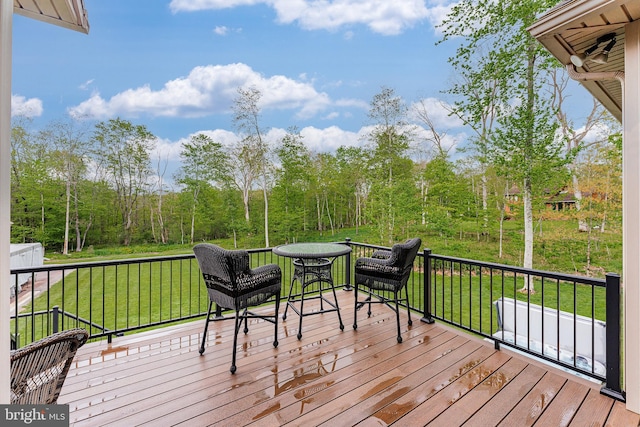 wooden terrace with a yard