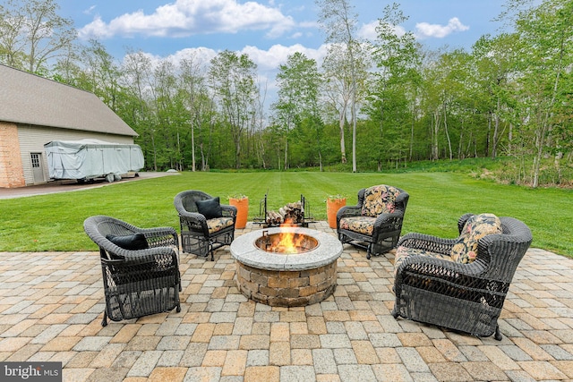 view of patio / terrace featuring an outdoor fire pit