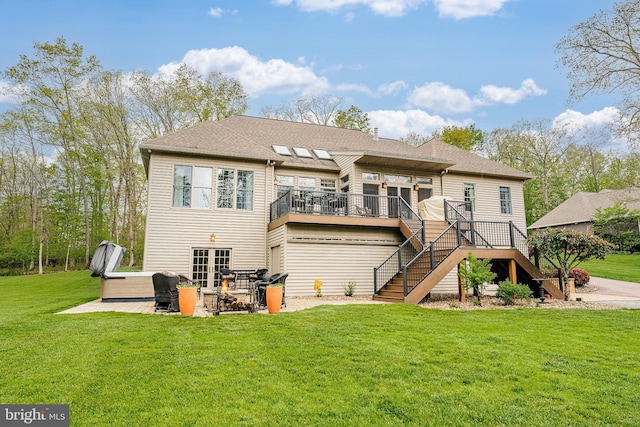 back of house featuring stairway, a wooden deck, french doors, a yard, and a patio