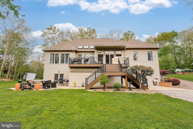 back of property with a patio area, a deck, stairs, and a yard