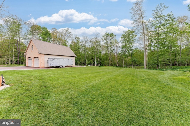 view of yard with a garage