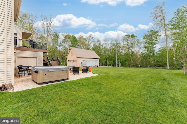 view of yard featuring a patio, stairway, an outbuilding, a hot tub, and a deck