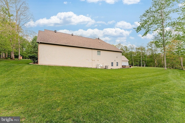 rear view of house with a lawn