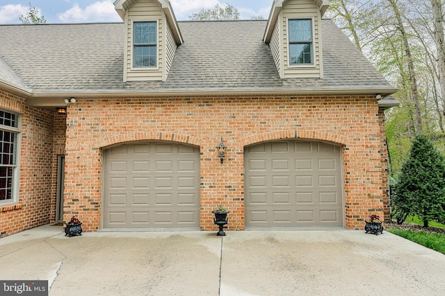 garage featuring driveway