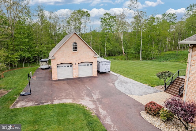 garage with aphalt driveway