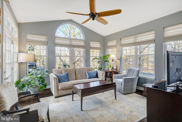 sunroom featuring vaulted ceiling, a wealth of natural light, and a ceiling fan