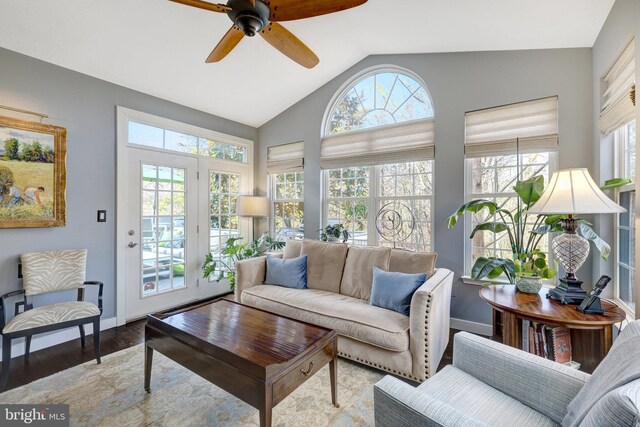 sunroom with vaulted ceiling, ceiling fan, and a healthy amount of sunlight