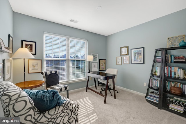 office space featuring carpet, visible vents, and baseboards