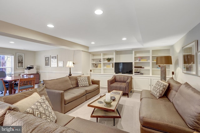 living room with built in features and recessed lighting