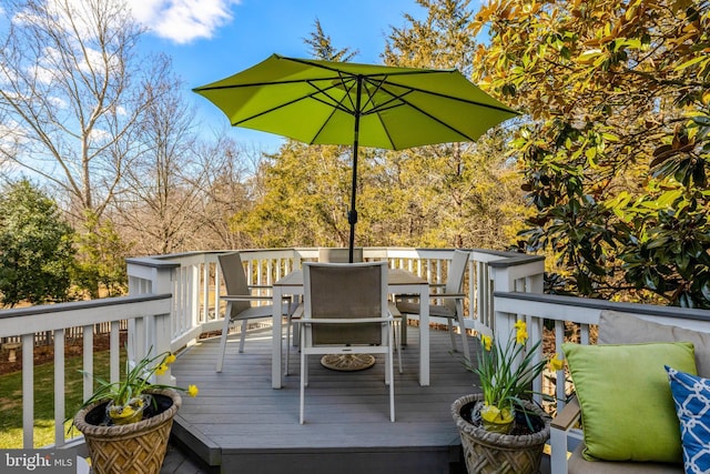 wooden deck with outdoor dining area