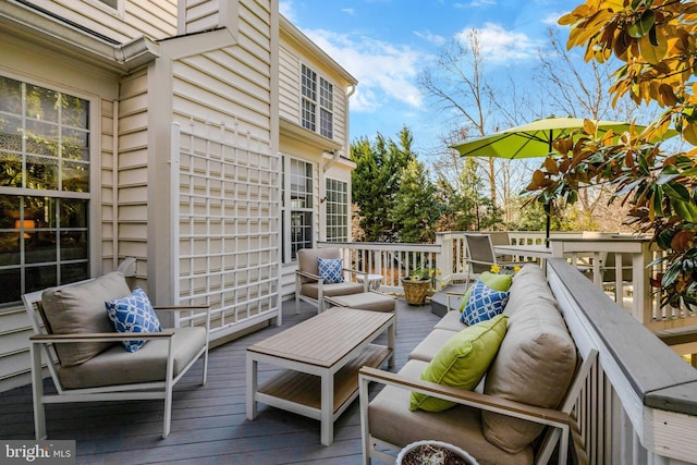 wooden deck with an outdoor hangout area