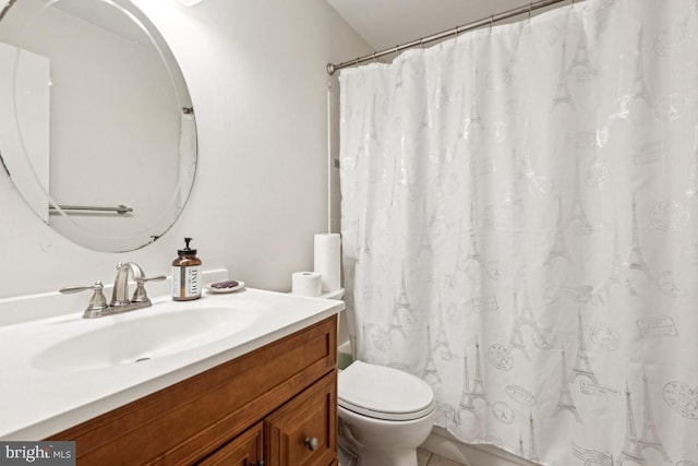 bathroom featuring toilet and vanity