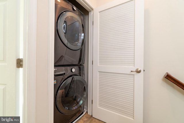 laundry area featuring laundry area and stacked washer / dryer