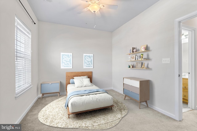 bedroom with carpet, baseboards, and a ceiling fan