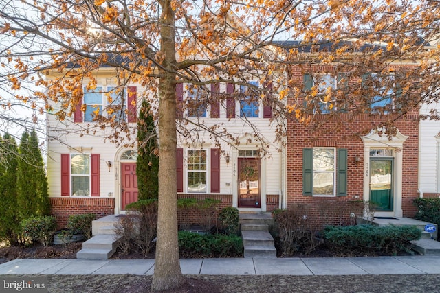 view of property with brick siding