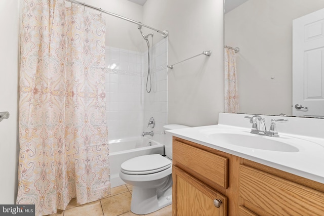 full bath with shower / bath combo, vanity, toilet, and tile patterned floors