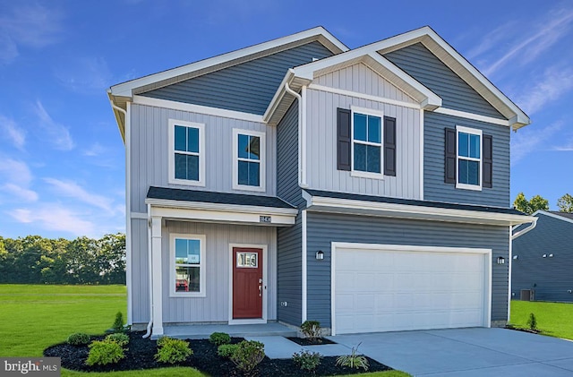 view of front facade featuring board and batten siding, a front yard, driveway, and a garage