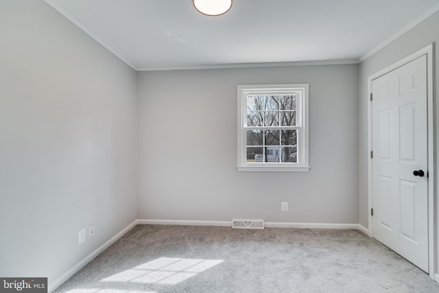 unfurnished bedroom with carpet, crown molding, visible vents, and baseboards