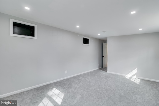 finished below grade area featuring carpet floors, baseboards, and recessed lighting