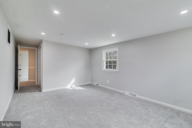 unfurnished room featuring baseboards, carpet, visible vents, and recessed lighting