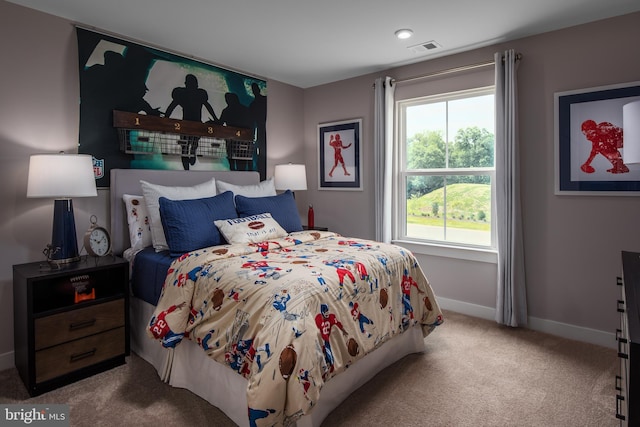 bedroom featuring carpet floors, baseboards, and visible vents