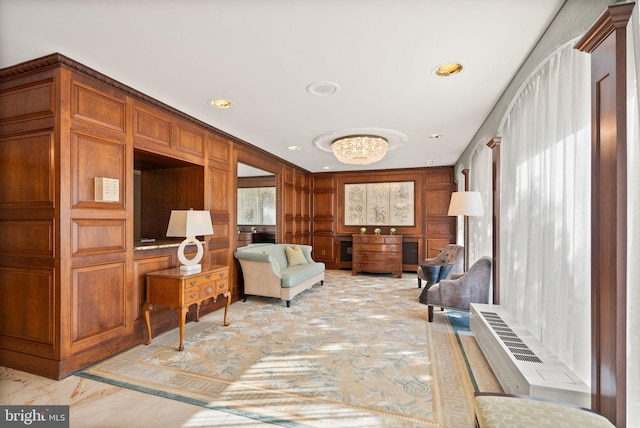 sitting room with wooden walls and recessed lighting