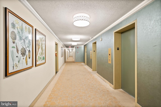 hallway with elevator, a textured ceiling, and crown molding