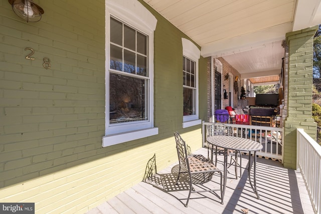 wooden deck featuring a porch