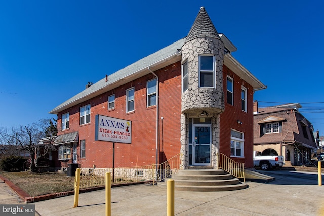 view of building exterior with cooling unit