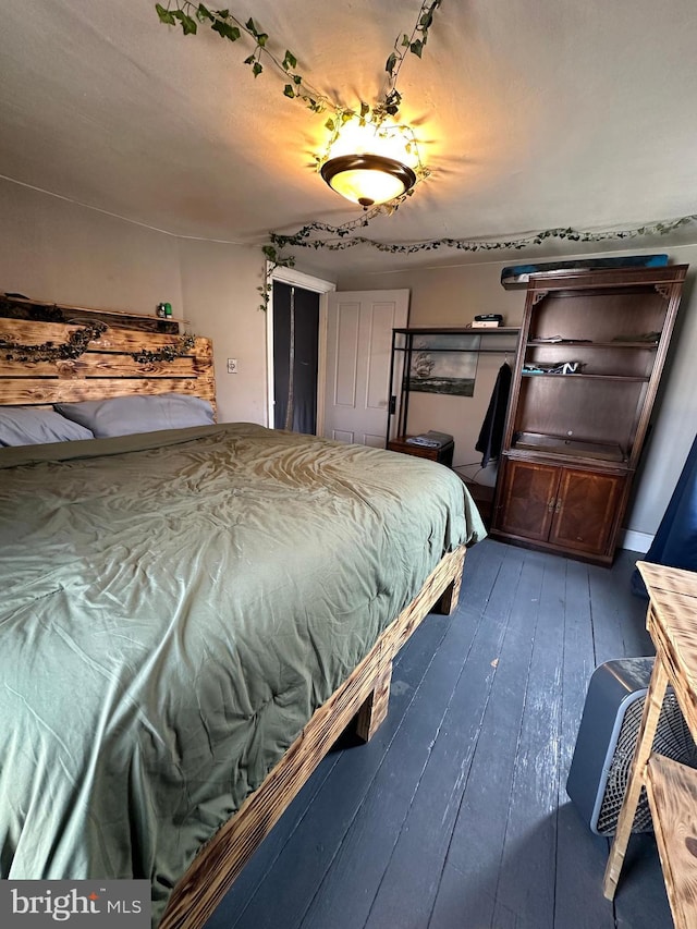 bedroom featuring hardwood / wood-style flooring