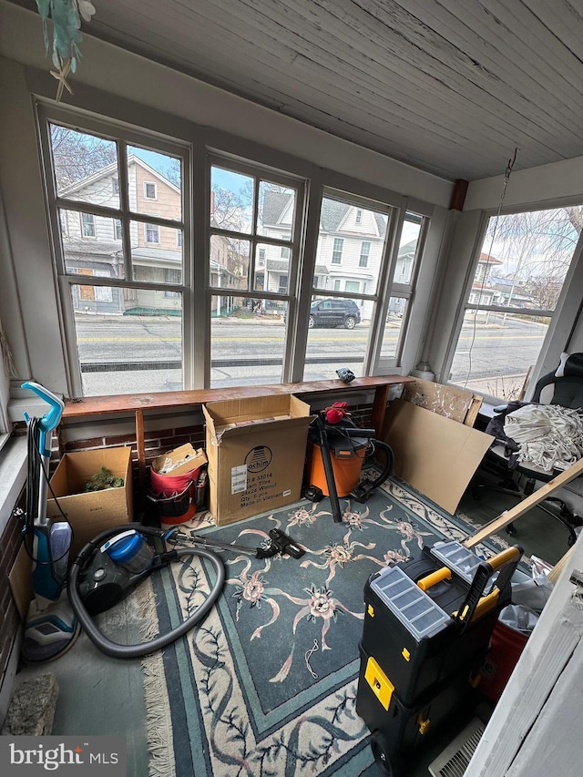 sunroom / solarium featuring wooden ceiling