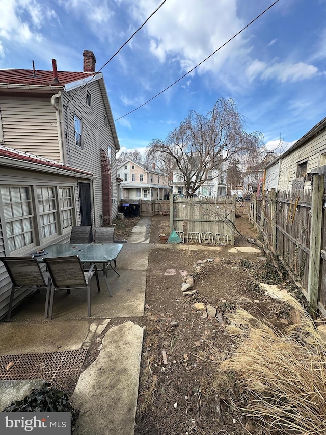 view of yard with a patio area and a fenced backyard