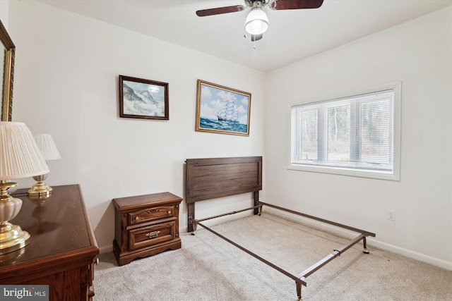 carpeted bedroom featuring ceiling fan and baseboards