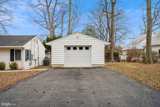 detached garage with driveway and central AC