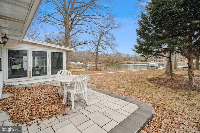 view of patio with a water view