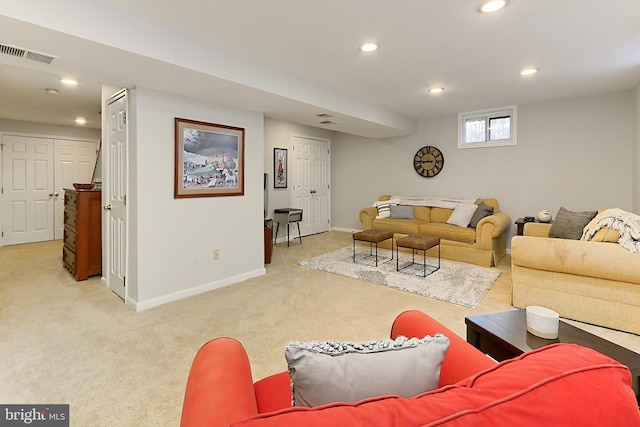 living room featuring light carpet, baseboards, visible vents, and recessed lighting