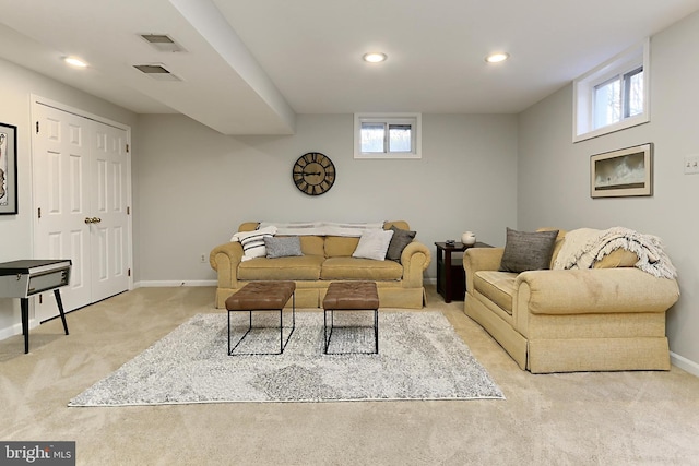 carpeted living room featuring recessed lighting, a healthy amount of sunlight, visible vents, and baseboards