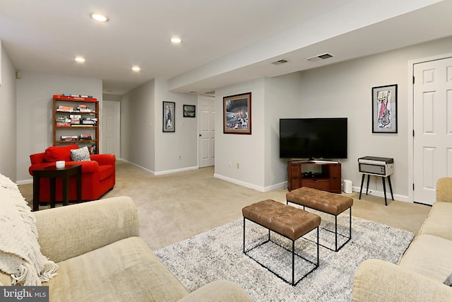 living area featuring baseboards, visible vents, light colored carpet, and recessed lighting