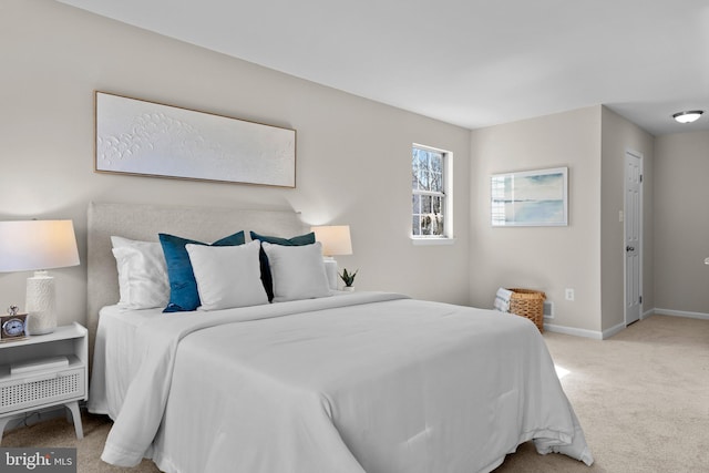 carpeted bedroom with baseboards