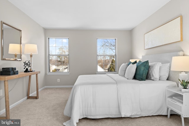 bedroom with carpet flooring and baseboards