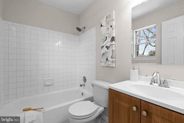 bathroom featuring  shower combination, vanity, and toilet