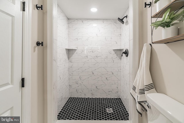 full bathroom with toilet, a stall shower, and recessed lighting