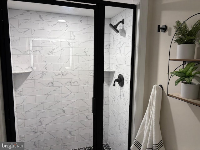 bathroom featuring a shower stall