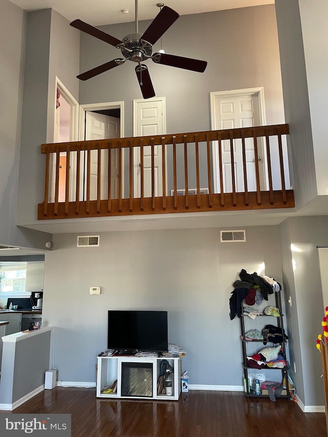 interior space with visible vents, baseboards, and wood finished floors