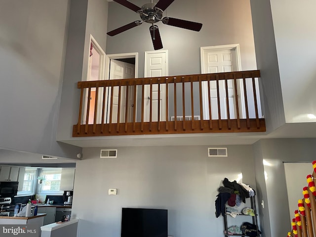 interior space featuring black appliances, visible vents, and a ceiling fan