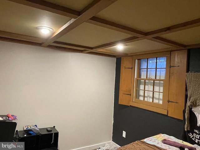 bedroom with beam ceiling and coffered ceiling