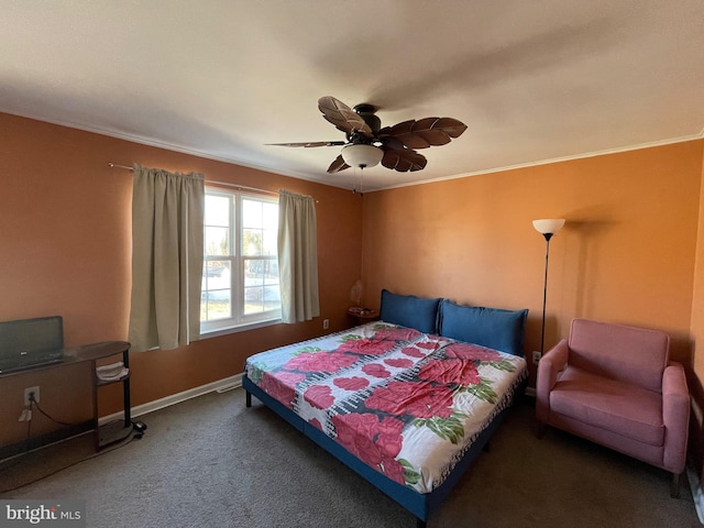 carpeted bedroom featuring baseboards, ornamental molding, and a ceiling fan